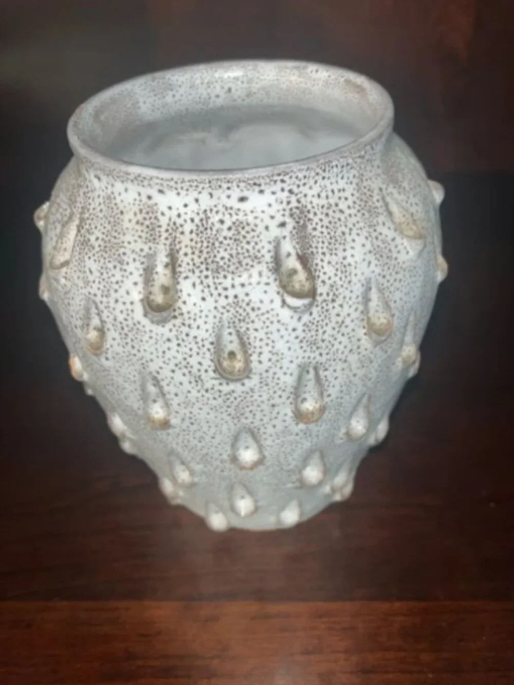 Ceramic vase with white speckled teardrop-shaped patterns